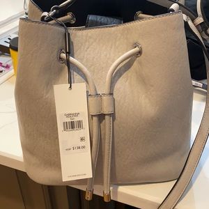 New Calvin Klein purse approx 12 x 12 adj. opening drawstring close & magnetic
